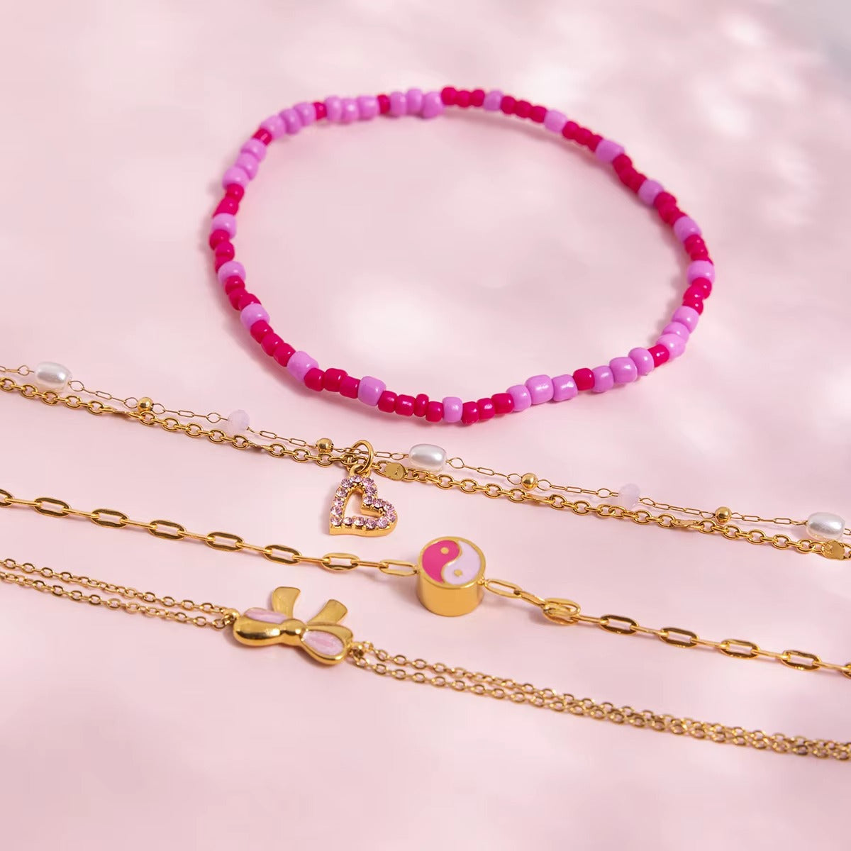 Pulsera Perlas y Corazón Rosa