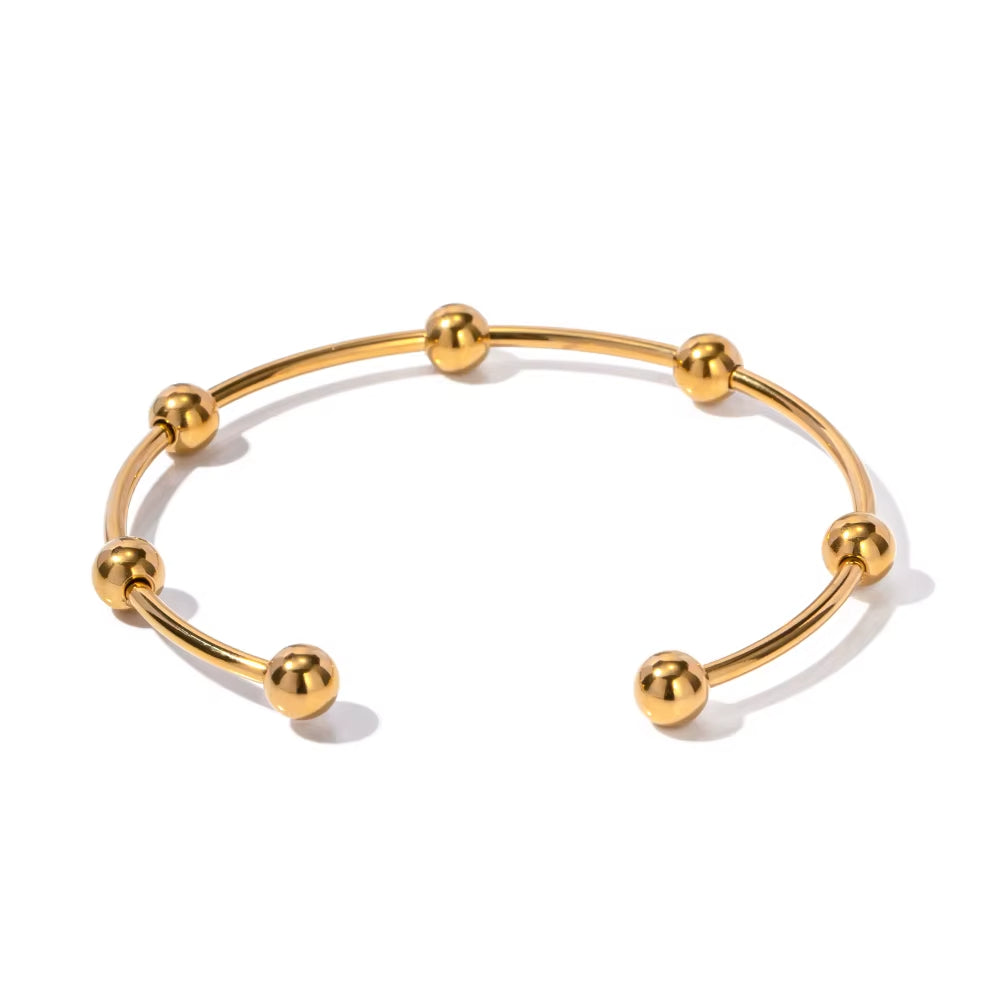 Pulsera Cuff con Esferas Doradas